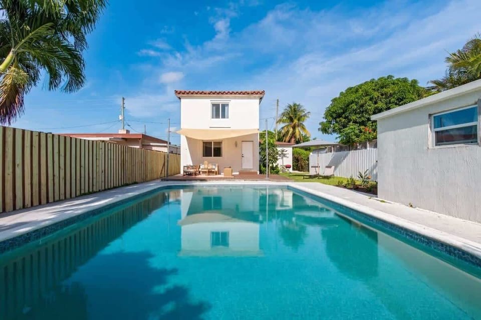 Sparkling pool surrounded by a relaxing lounge space for sunny days.