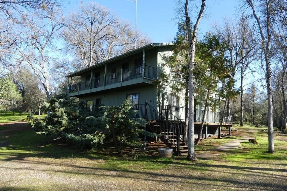 The house, from the driveway and parking area.