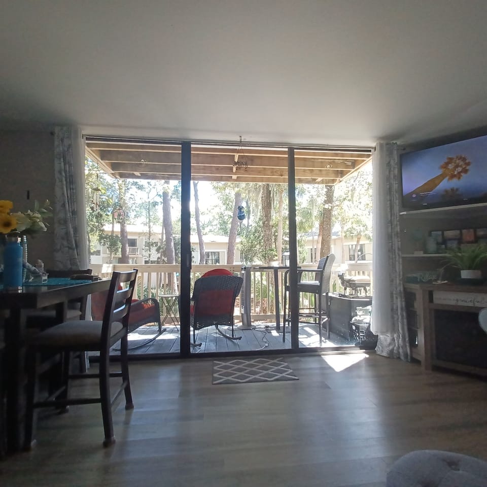 Deck has a great courtyard view, pond and fountain. Rocking chairs, or bar seats