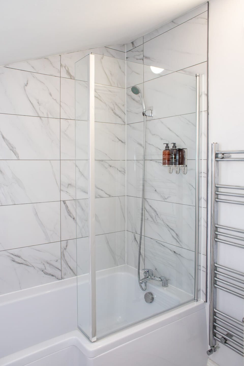 Contemporary bathroom with stylish bath and  shower, perfect for relaxing after a long day.