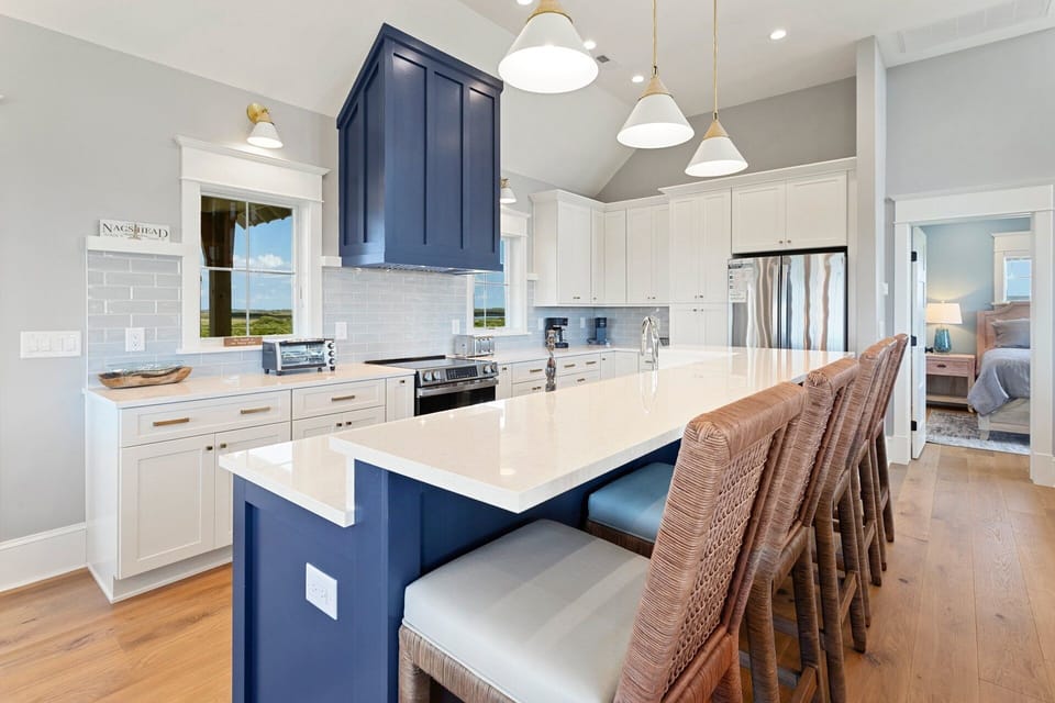 Whip up something delicious in the gorgeous modern Kitchen with expansive island!