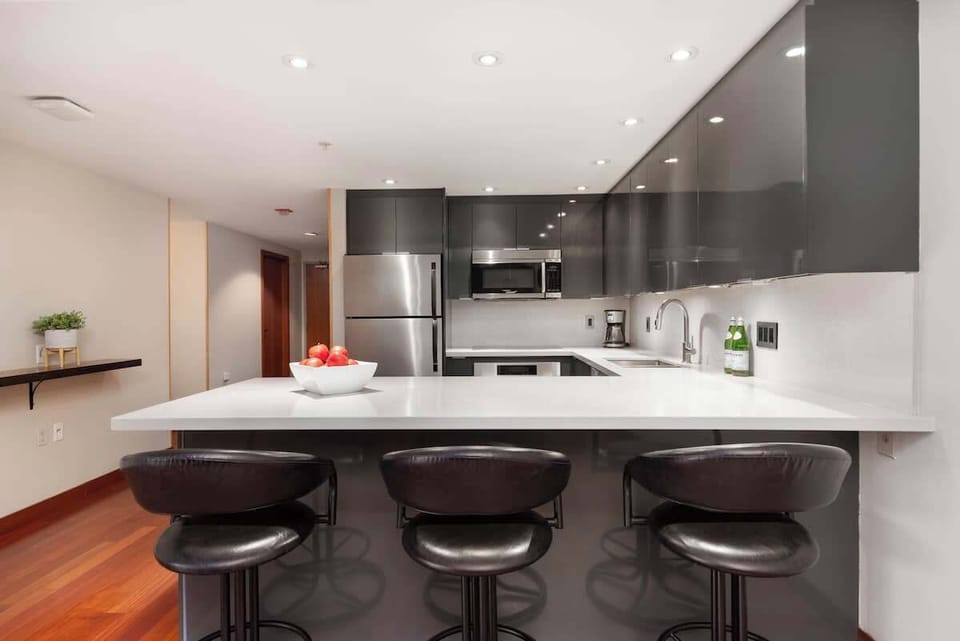 - Modern kitchen featuring stainless steel appliances and bar seating  
- Ideal for breakfast gatherings before hitting Whistler slopes  
- Fully equipped layout with everything needed for your stay  