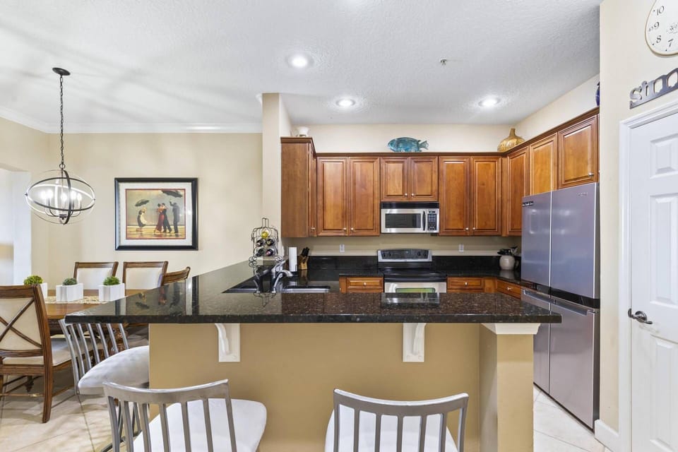 Modern kitchen with counter seating, perfect for casual meals or socializing while cooking.