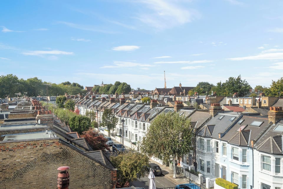Window views in Fulham London rental overlooking shops, cafés & local streets.