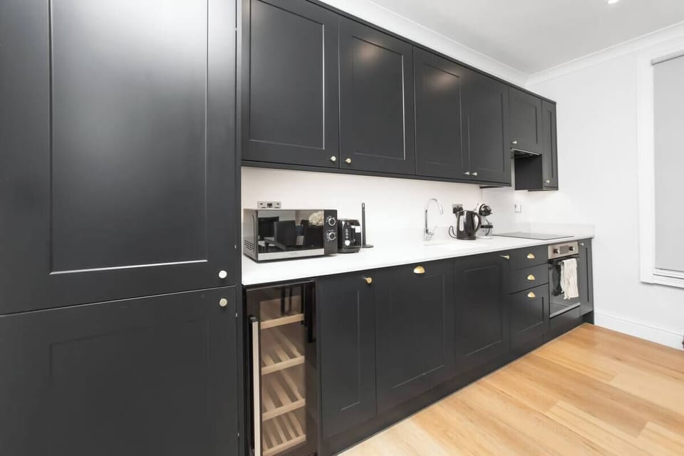 Fully equipped kitchen in Fulham London rental with coffee maker & appliances.