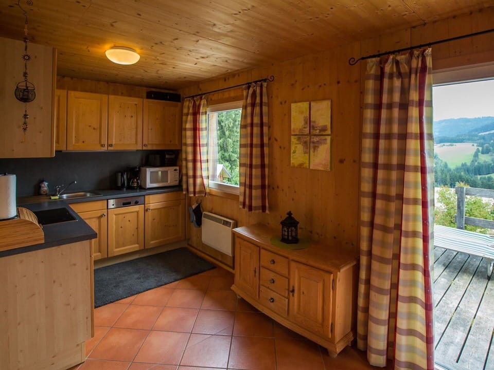 Wood, Interior Design, Furniture, Flooring, Room, Ceiling, Floor, Kitchen, Wood Stain, Cabinetry