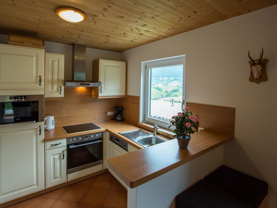 Furniture, Flooring, Interior Design, Kitchen, Wood, Countertop, Cabinetry, Kitchen Appliance, Ceiling, Floor