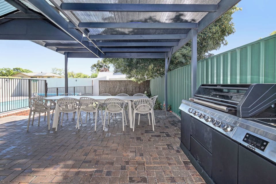 Open Plan Dining and Kitchen Area - with Fully equipped kitchen, 8 seater dining table and mounted SAMSUNG frame TV