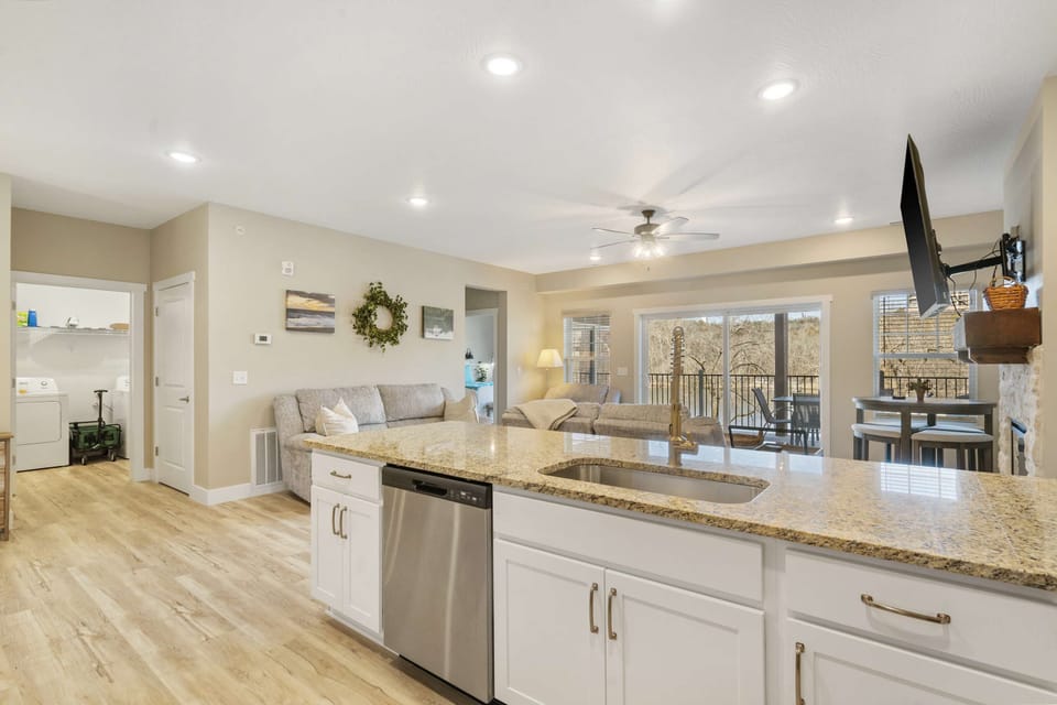 The airy, open kitchen offers ample space & every home comfort