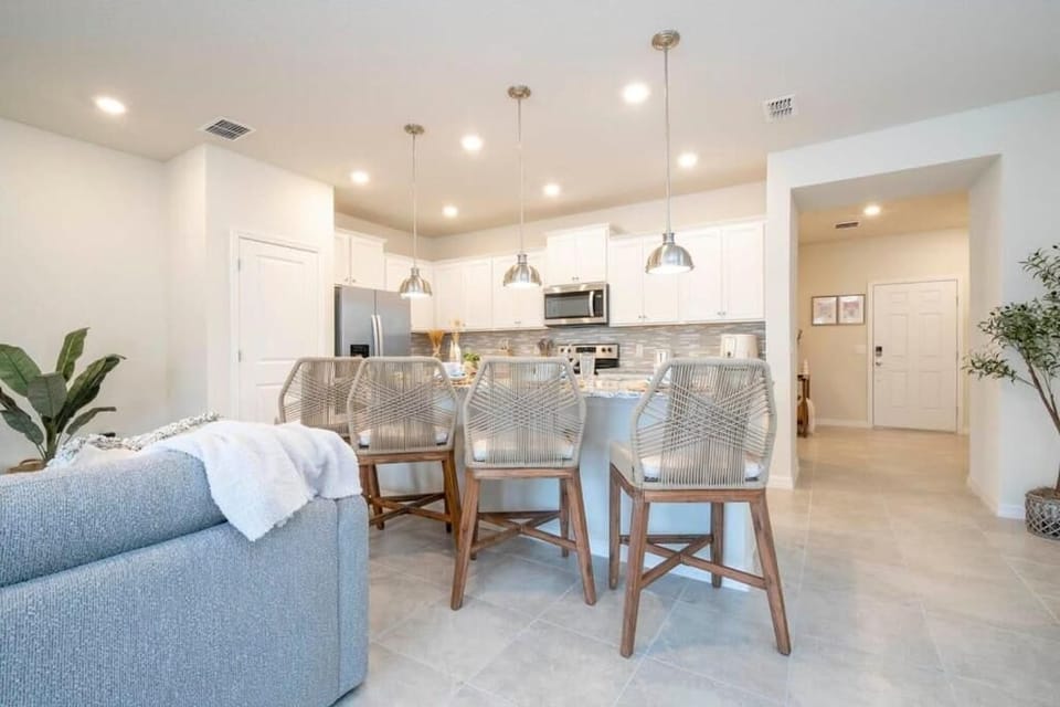 Bright and modern open-concept living space with stylish kitchen and dining area.