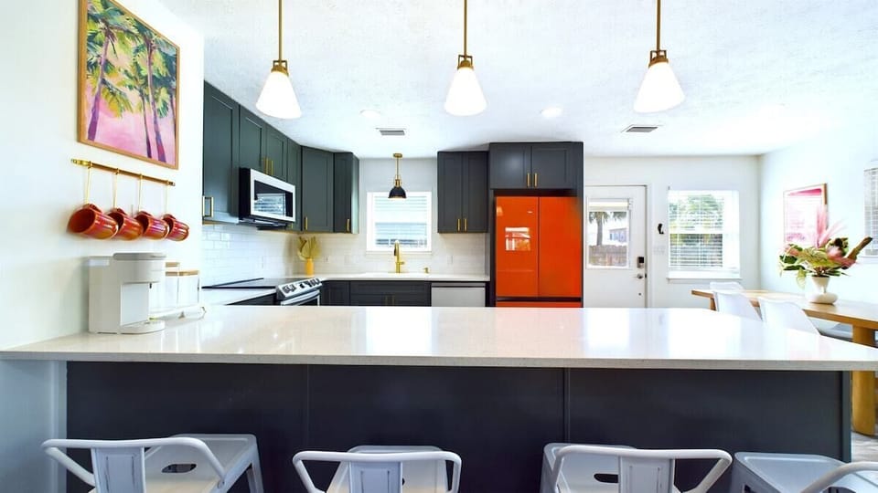 Start your day at the cozy breakfast bar that seats 4, perfect for enjoying a quick morning meal or sipping your coffee while planning the day ahead.