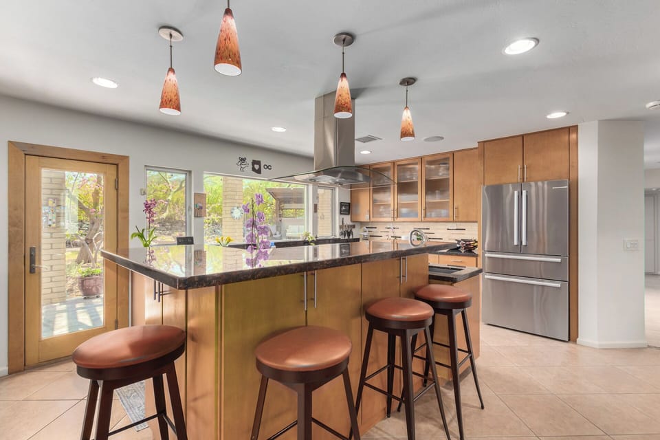 Kitchen with Island and Stainless Steel Appliances