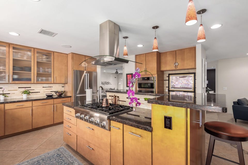 Kitchen with Island and Stainless Steel Appliances
