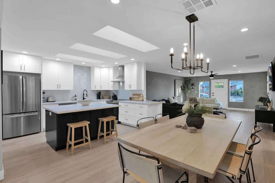 Sleek, modern kitchen with skylight and island seating for casual meals