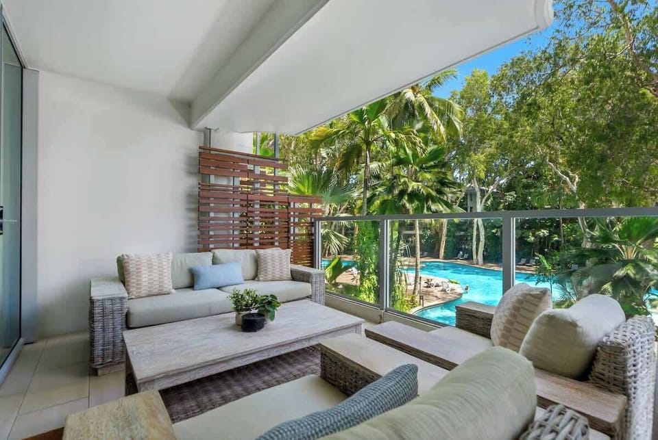 Sip a glass of wine on the balcony lounge, shared by the primary suite and living area, while overlooking the serene lagoon pool.