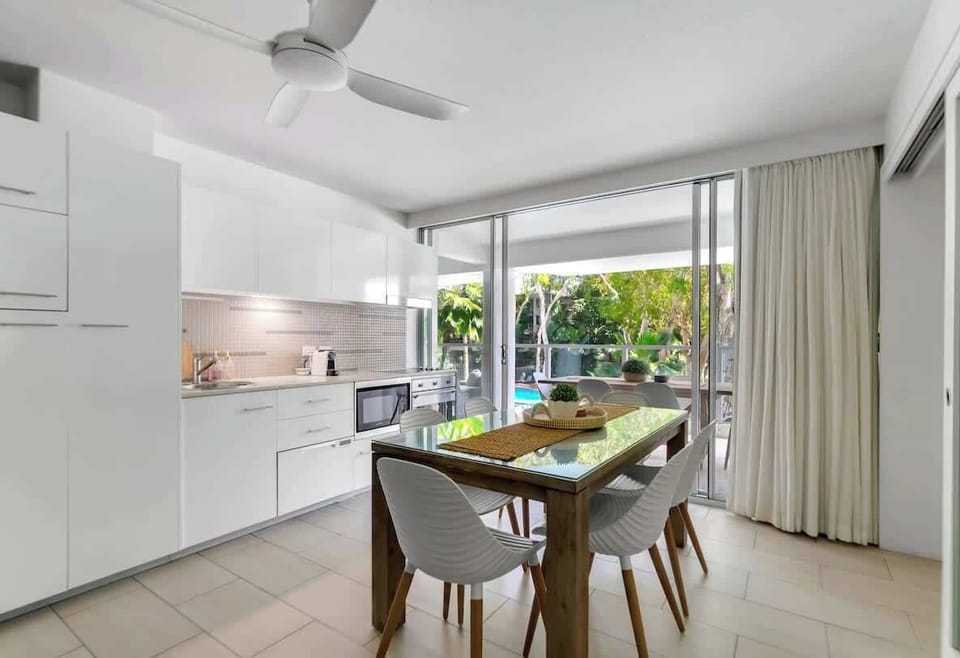 Gather around the six-seater glass-top dining table and enjoy meals filled with laughter and great conversation.