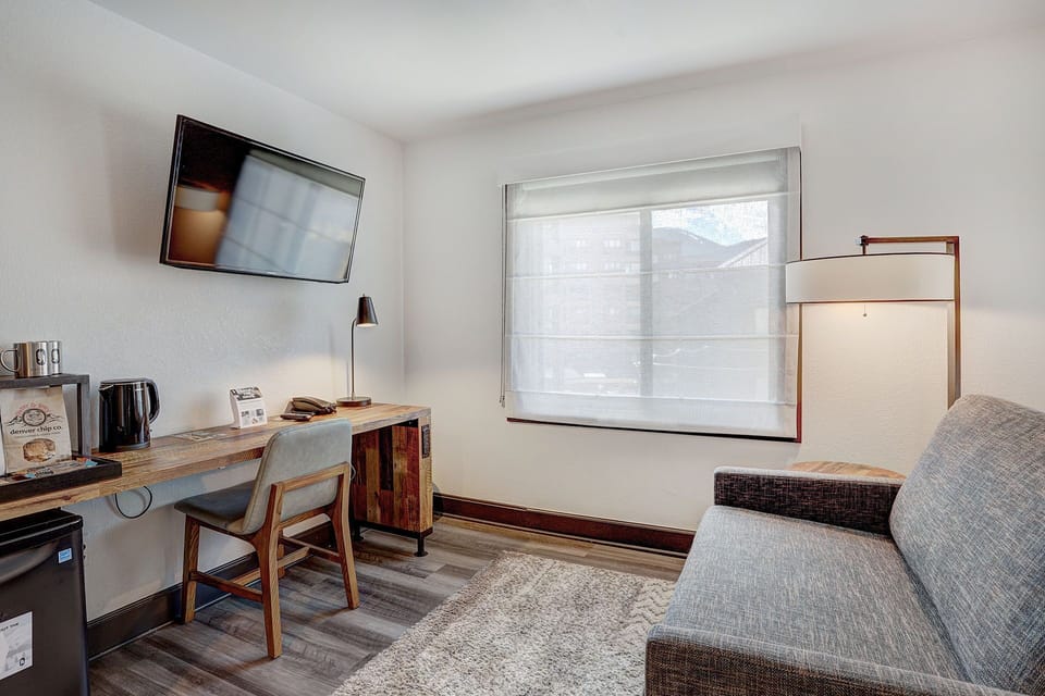 Functional and stylish workspace with natural light, perfect for both relaxation and productivity.