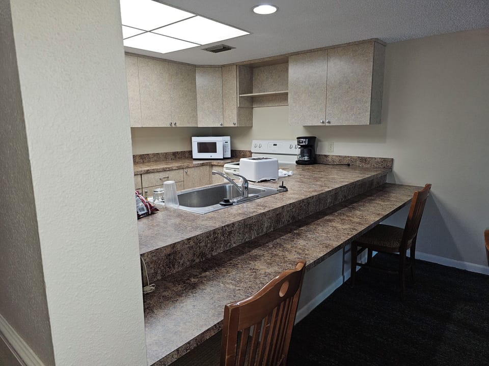 Bar seating in addition to the dining table.