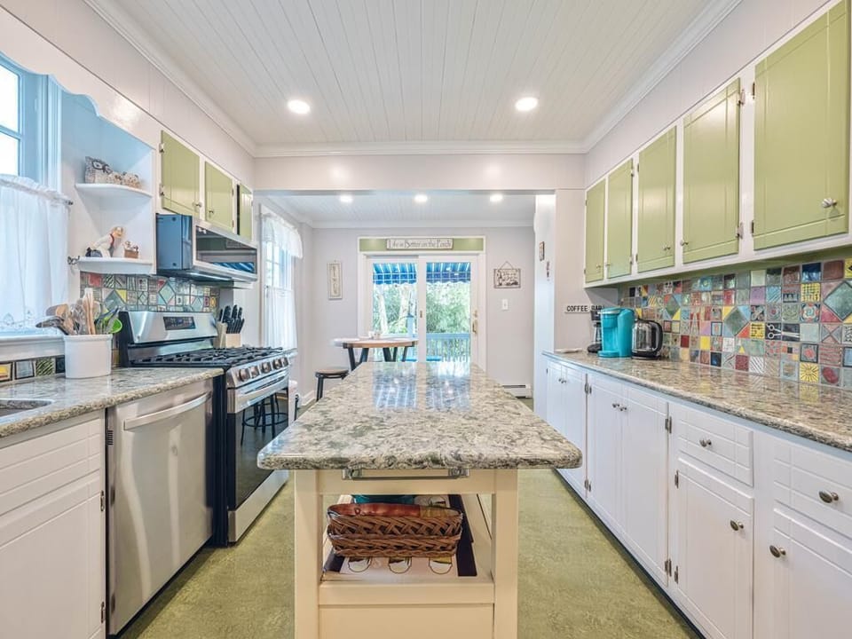 Bright kitchen with colorful accents and modern appliances.