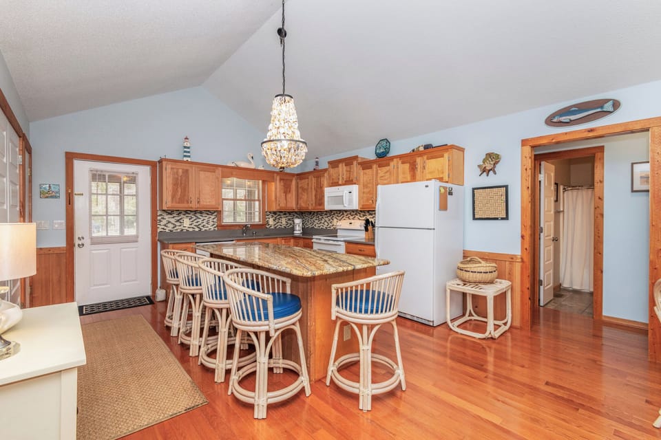Well-Stocked Kitchen – Ample counter space, modern appliances, and everything you need to cook like home.