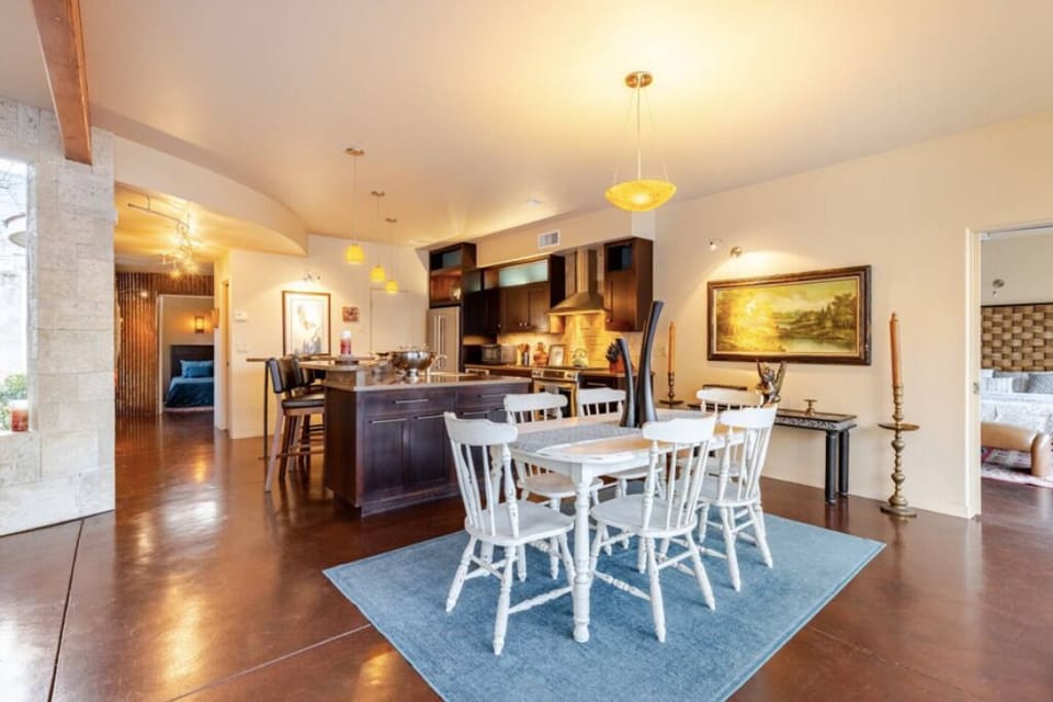 Elegant dining room for 6 people with beautiful river views and warm lighting.