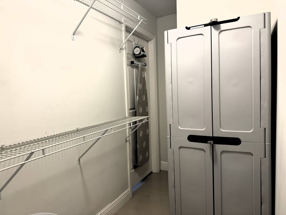 Iron & board in 1st Master Bedroom closet