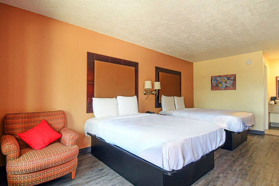 Settle in together with two comfy beds and cozy seating.