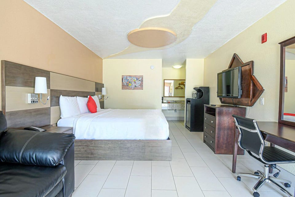 Spread out comfortably with TV, desk, and open space.