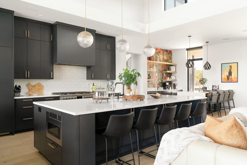 Additional seating is placed around the kitchen island.