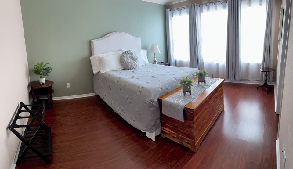 Queen Master with blackout curtains an attached bathroom and a 40inch smart tv