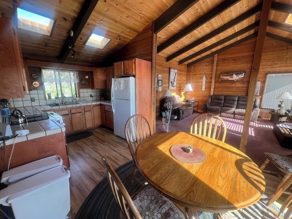 Kitchen, dining corner, living room, fun local ocean memorabilia.
Deck entrance 