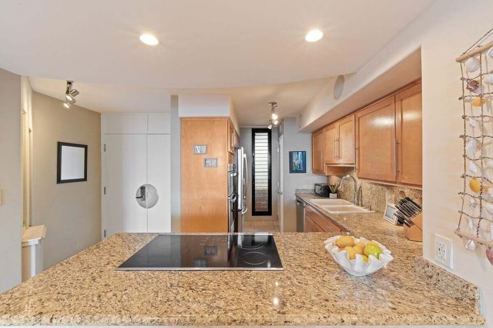 Fully equipped kitchen with spacious counters and stainless steel appliances