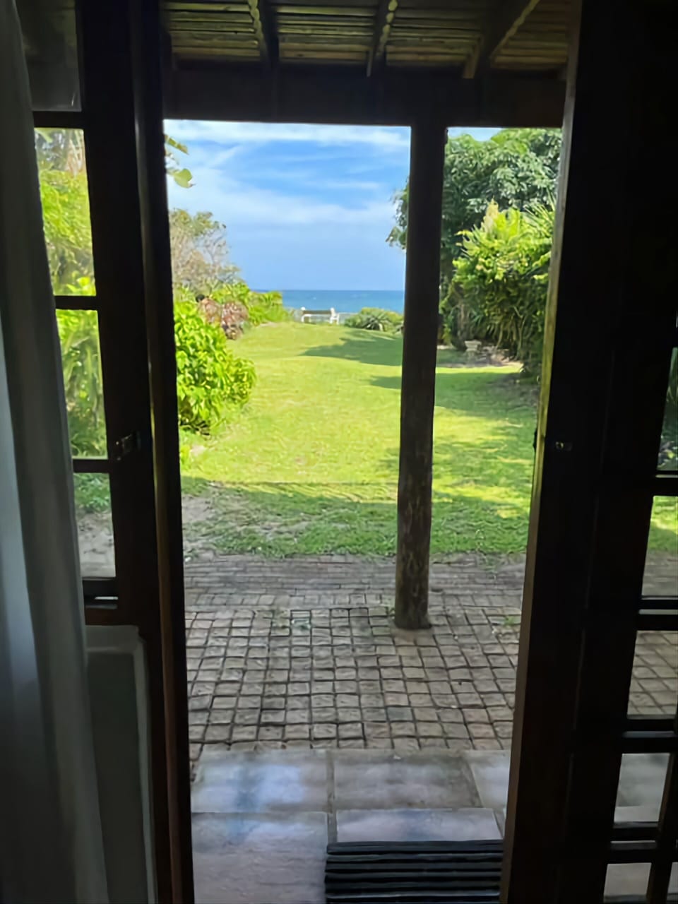 View of the sea from the open patio door 