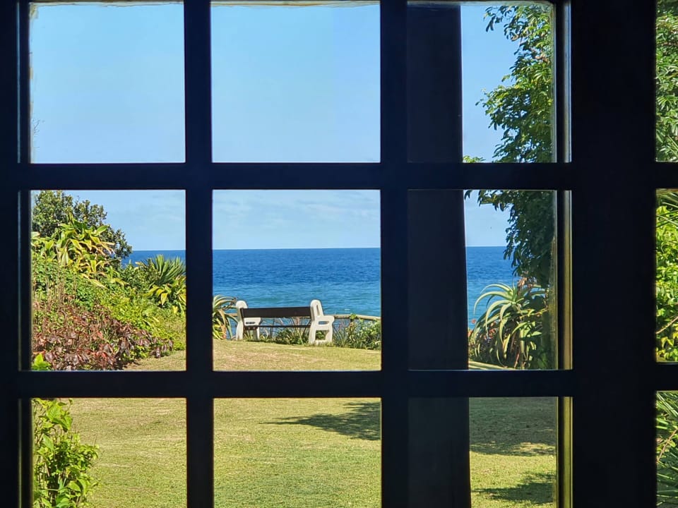 View of the sea from the bed 