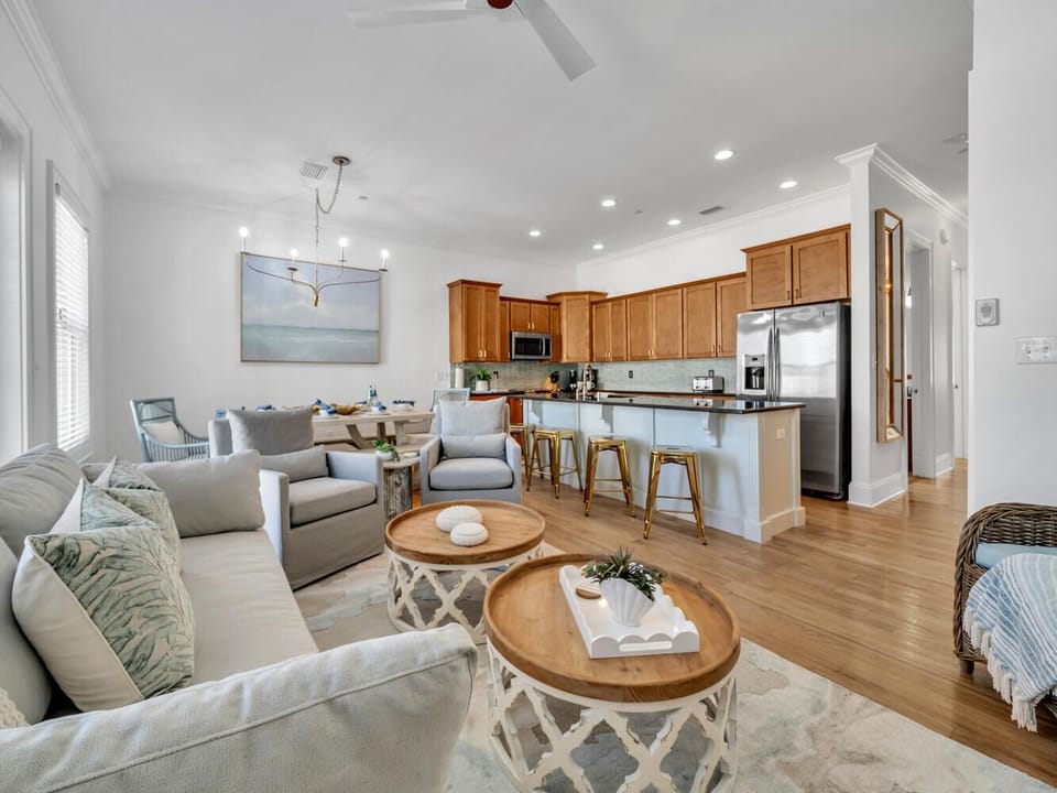 Unwind in this bright open-plan space where coastal vibes meet modern comfort. Your living room flows seamlessly into a fully equipped kitchen.