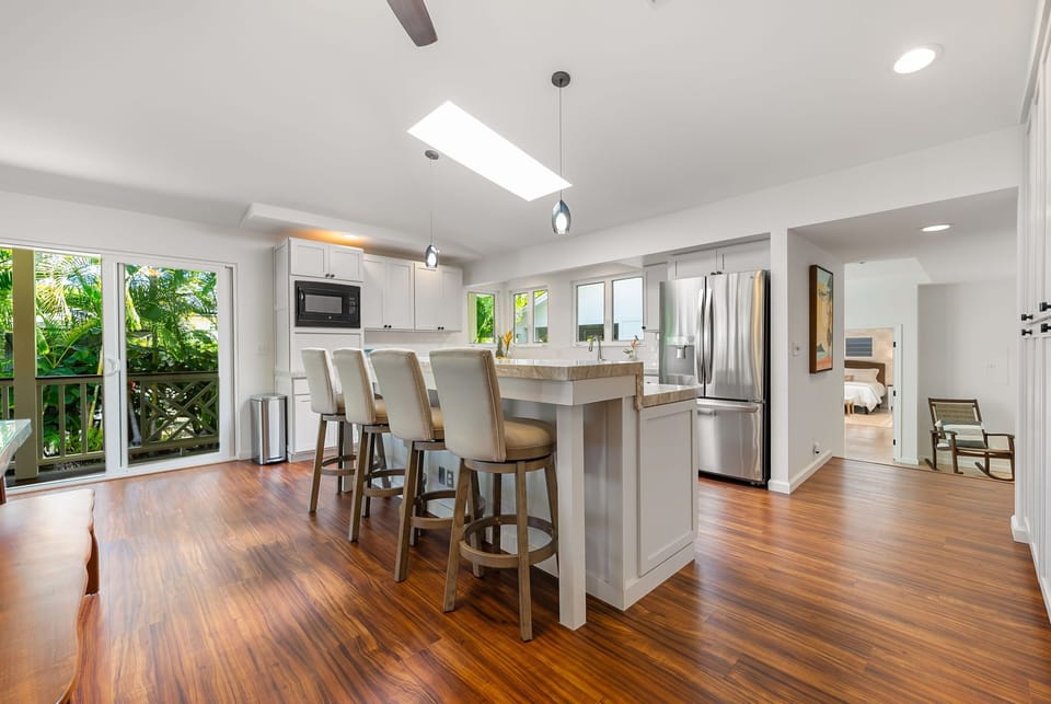 Spacious and bright, this open-concept layout connects the kitchen and dining areas seamlessly.