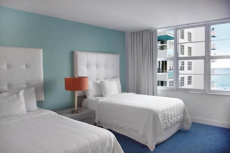 Settle into crisp beds and wake to sparkling sea views.