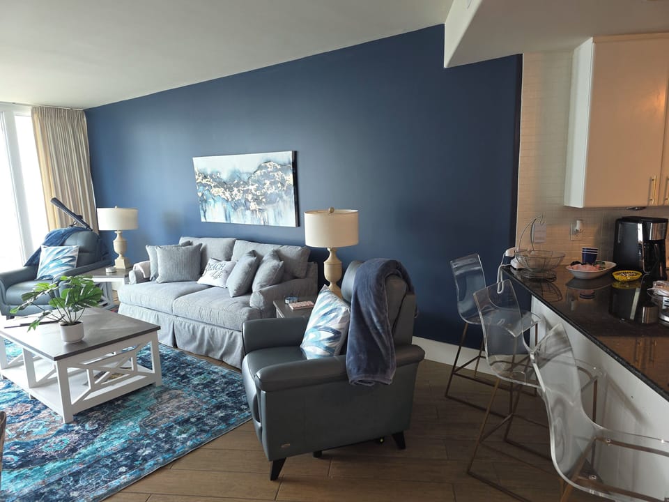 Cozy Oceanside living room with pull out queen bed and power recliners