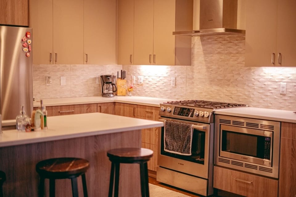 Gas range, oven, and microwave.