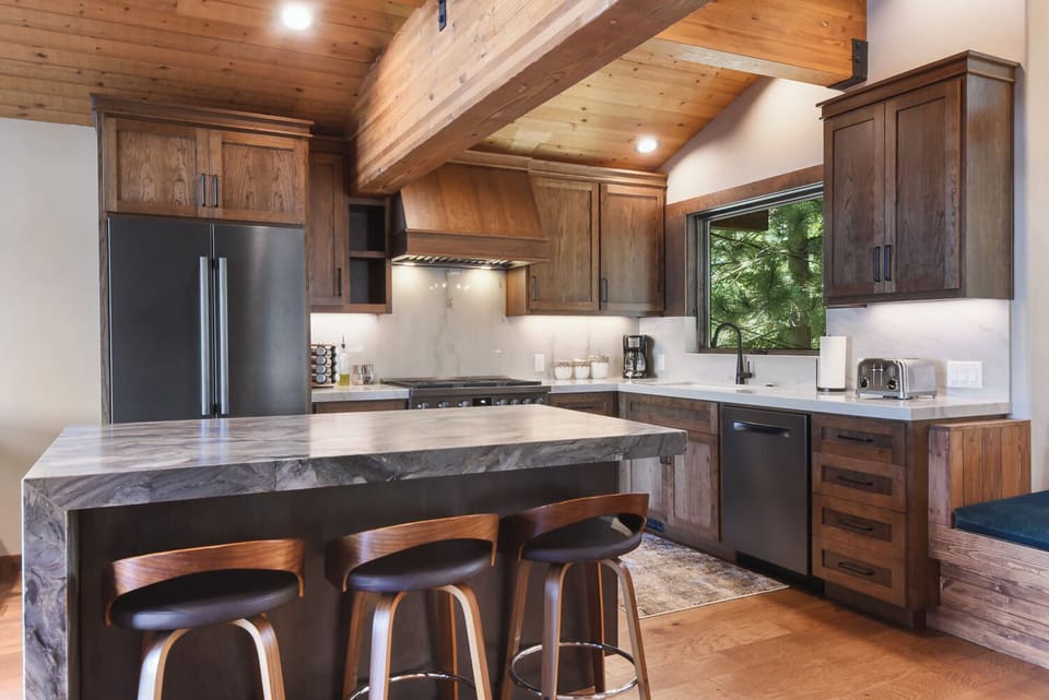 Full kitchen with drip coffee maker, microwave, dishwasher and more