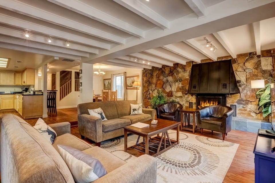 Living room w/ board games, wood burning fireplace, DVD player, Smart TV (Netflix, Hulu, etc.)