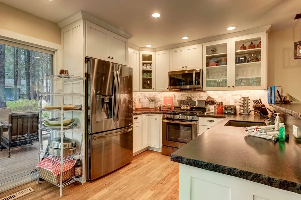 Full kitchen with stainless steel appliances, toaster and more
