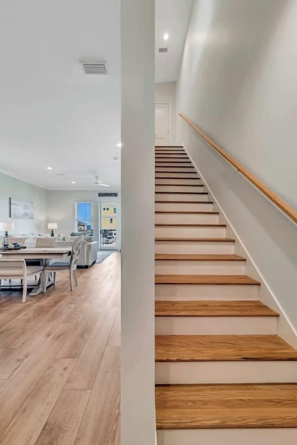 The stairs lead up to the 2nd floor where all the bedrooms are located. At the top of the stairs is a closet where beach towels, the sleeper sofa sheets and blanket, and pack and play are located.
