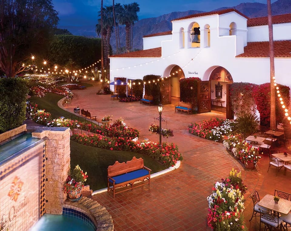 Stroll through a lantern-lit courtyard bursting with desert blooms.