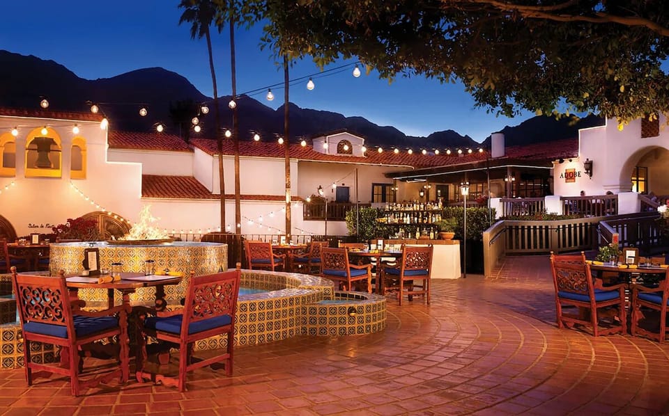 Soak up the evening glow in the festive courtyard setting.