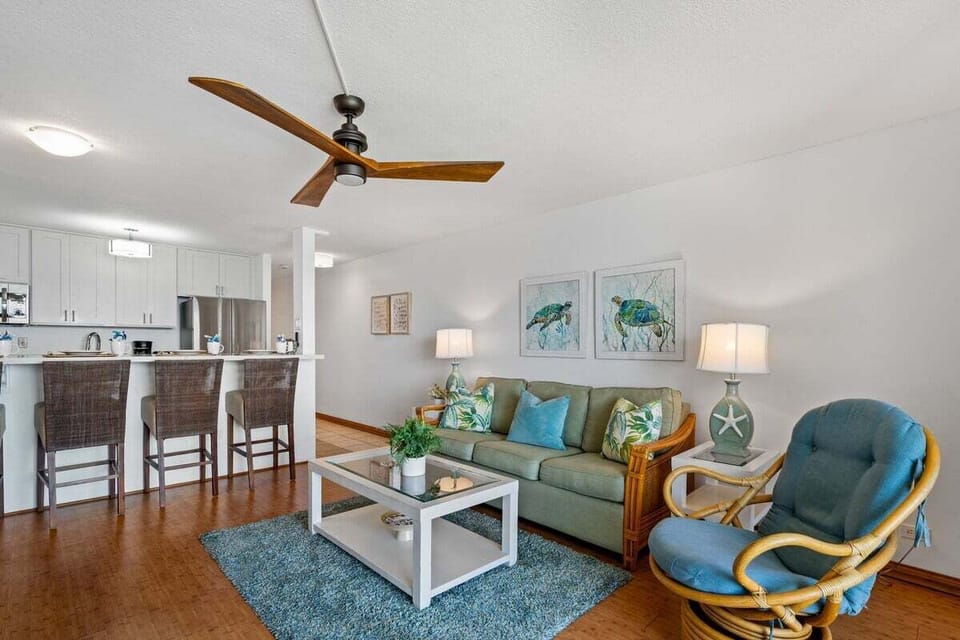 Comfortable sleeper sofa adds extra sleeping arrangements in a bright, coastal-themed living room