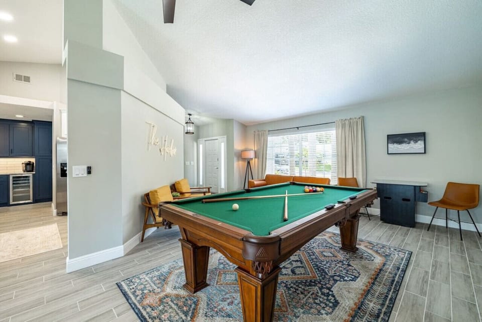Enjoy a game of pool in this modern entertainment lounge.