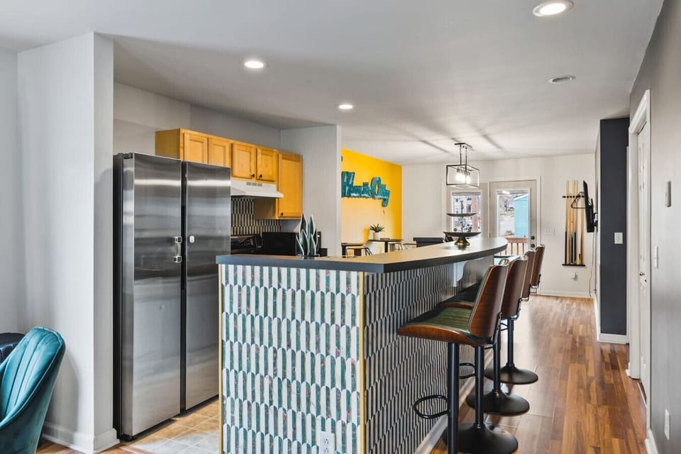 Fully equipped kitchen with all your cooking essentials, drip coffee maker + coffee. Dining table with seating for 4 + additional seating at kitchen counter. This room opens up into the living room, a Pool Table and our backyard patio with BBQ Grill
