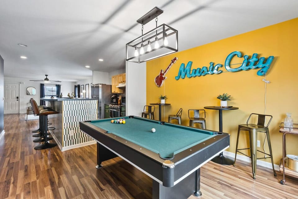 Pool Table with additional seating and bar cart!