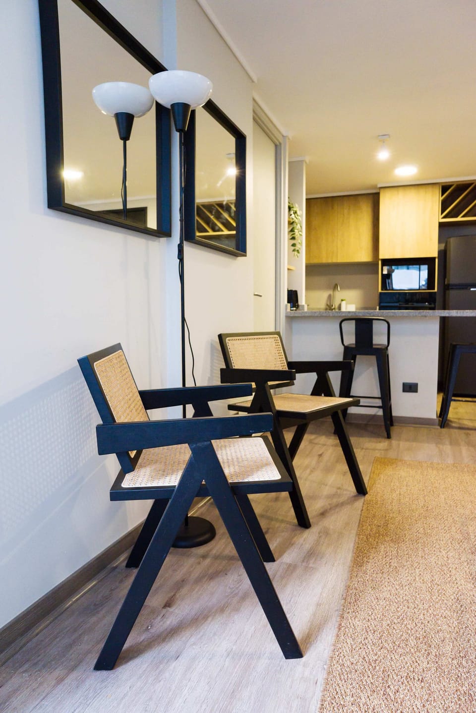 Relax in this stylish studio with a cozy seating area and modern kitchen, perfect for a comfortable stay in the heart of Chile.
